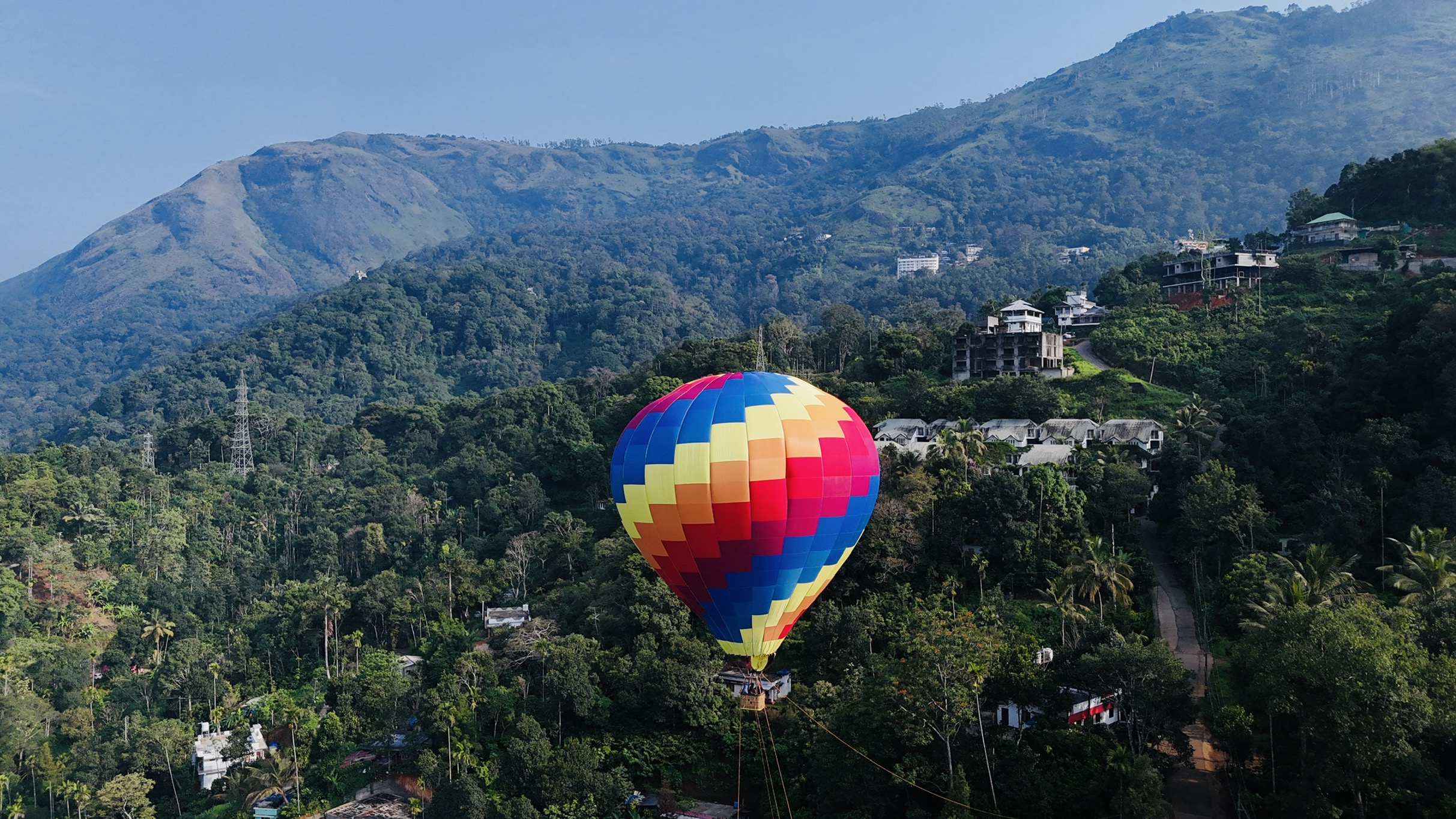 Happy tourists in hot air balloon